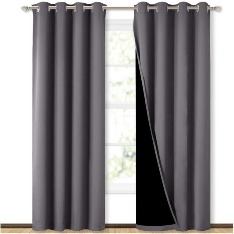 Gray curtains partially open, revealing a window and black lining