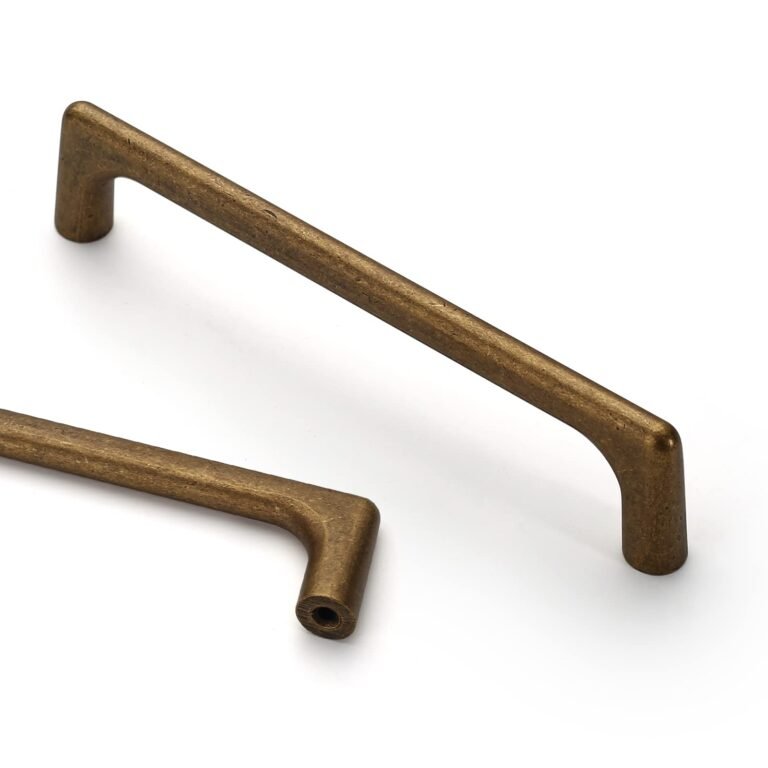 Two bronze-colored cabinet pulls on a white background