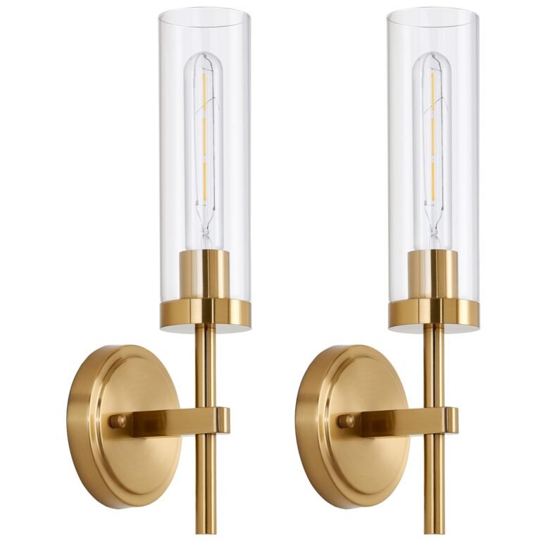 Two gold wall sconces with clear glass cylinder shades and bulbs