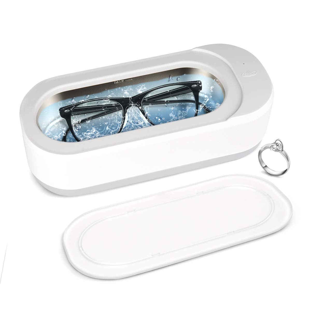Eyeglasses in a white ultrasonic cleaner with a ring nearby