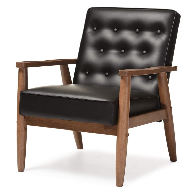 Black leather armchair with wooden frame and button-tufted back