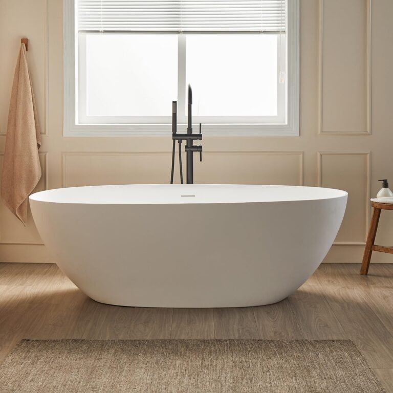 Oval freestanding bathtub with black faucet in a modern bathroom