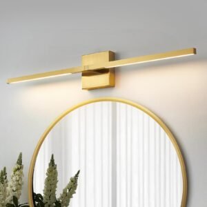 Gold wall-mounted light fixture above a round mirror with flowers