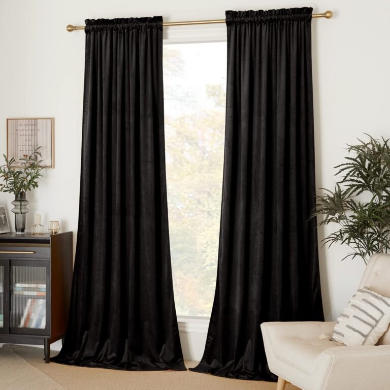 Black velvet curtains frame a window in a well-lit, modern living room