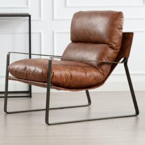 Brown leather armchair with metal frame in a modern interior