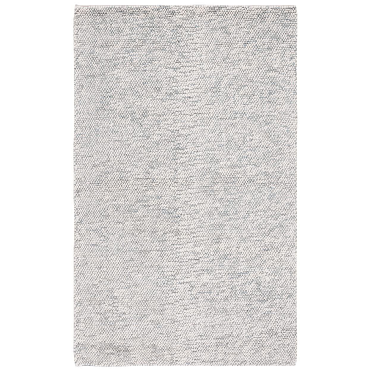 Rectangular, textured, light gray rug with subtle blue flecks