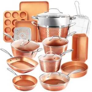 Copper-colored cookware set including pots, pans, baking sheets, and a steamer