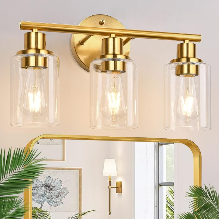 Gold bathroom vanity light fixture with three clear glass shades
