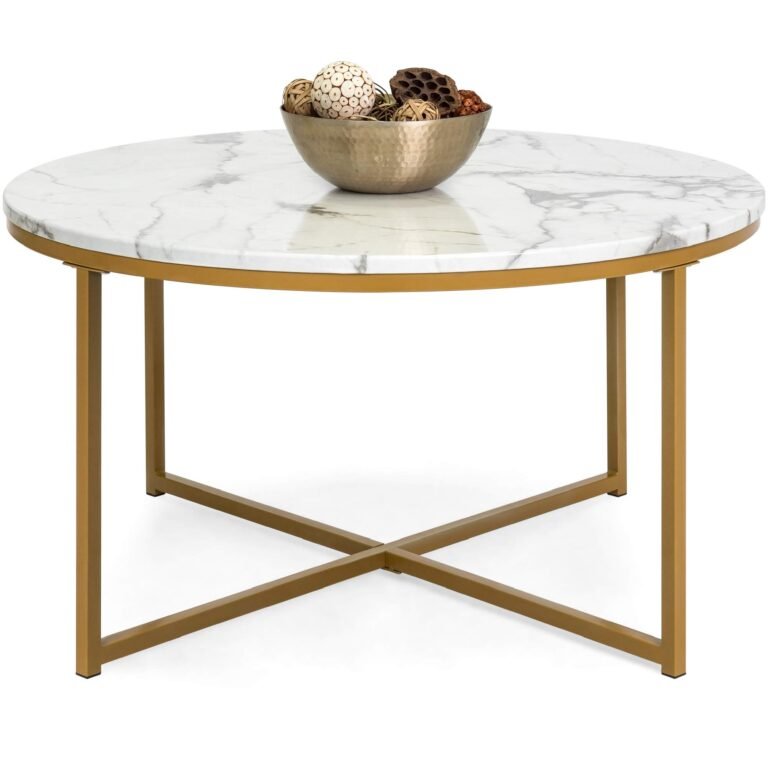 Round coffee table with marble top, gold legs, and decorative bowl