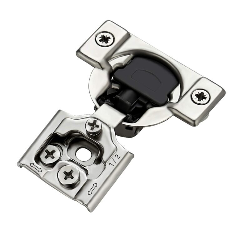 A metal cabinet hinge with screws, black plastic, and a 1/2 marking