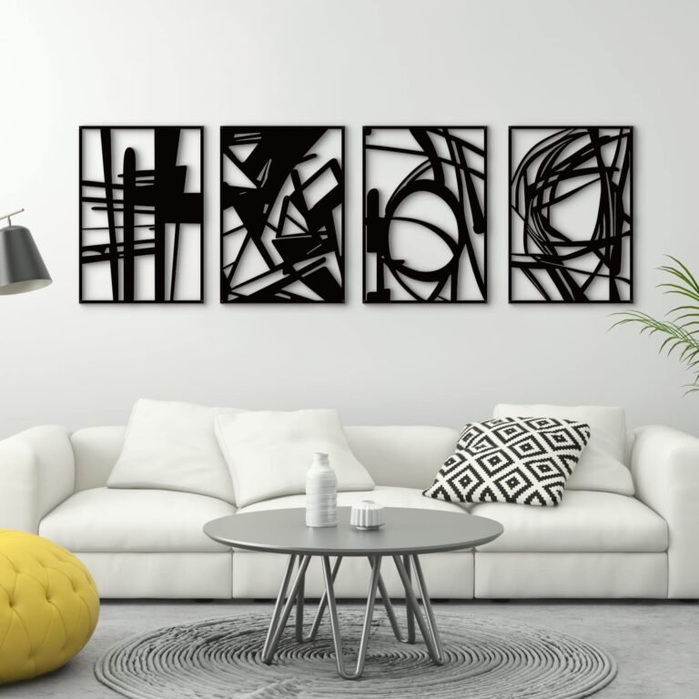 Four black abstract art pieces above a white couch