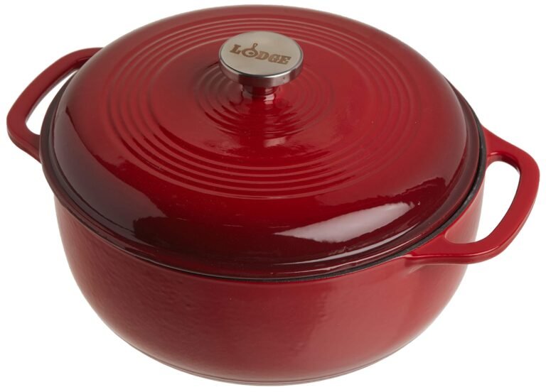 Red enameled cast iron Lodge Dutch oven with lid and handles
