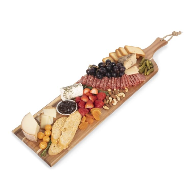 Wooden charcuterie board with cheese, meats, fruits, nuts, and bread