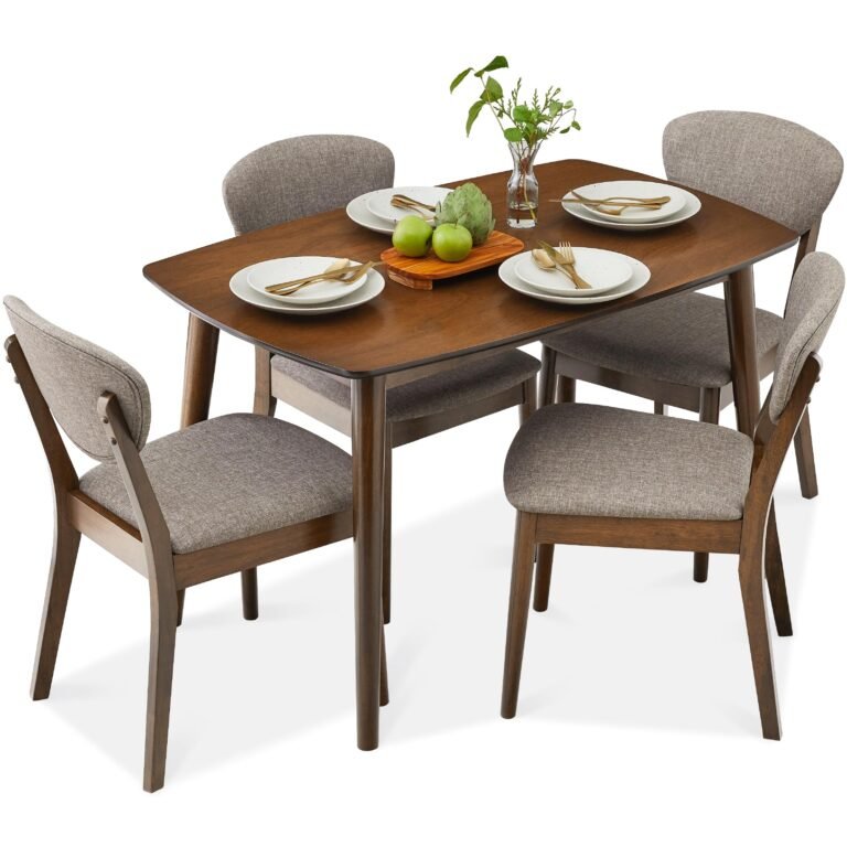 Dining table set with four chairs, plates, and decorative items