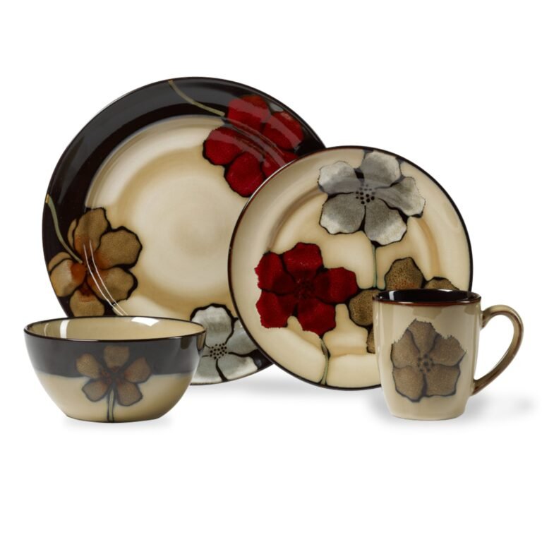 Floral-patterned dinnerware set including plates, bowl, and mug on a white background