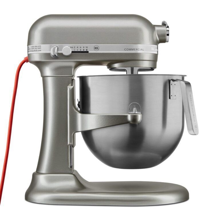 Silver KitchenAid commercial stand mixer with stainless steel bowl and red cord