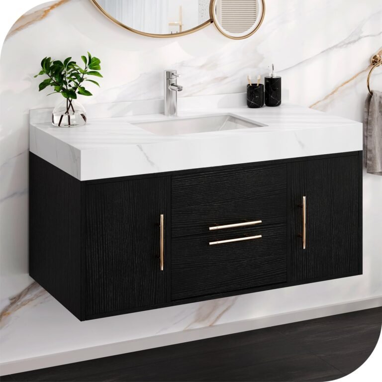 Black floating vanity with white countertop, gold hardware, and mirror