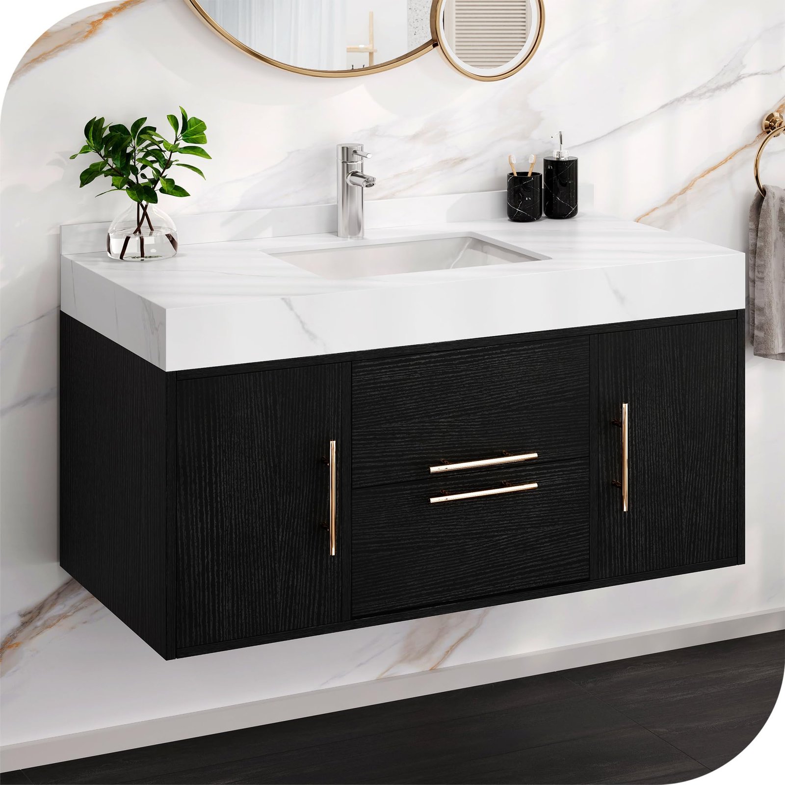 Black floating vanity with white countertop, gold hardware, and mirror