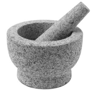 Gray granite mortar and pestle, used for grinding and crushing ingredients