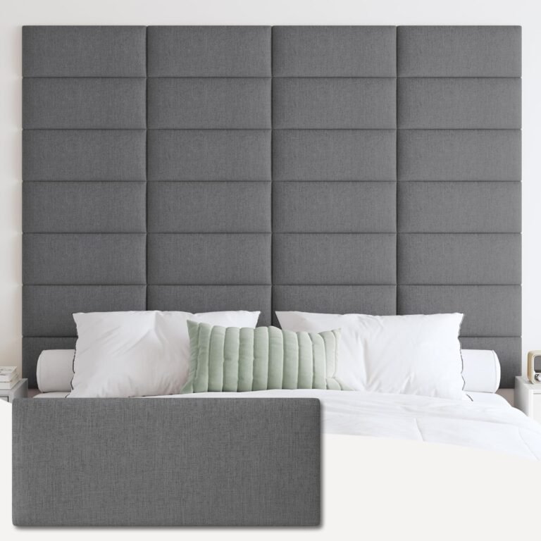 Gray upholstered headboard with pillows on a bed