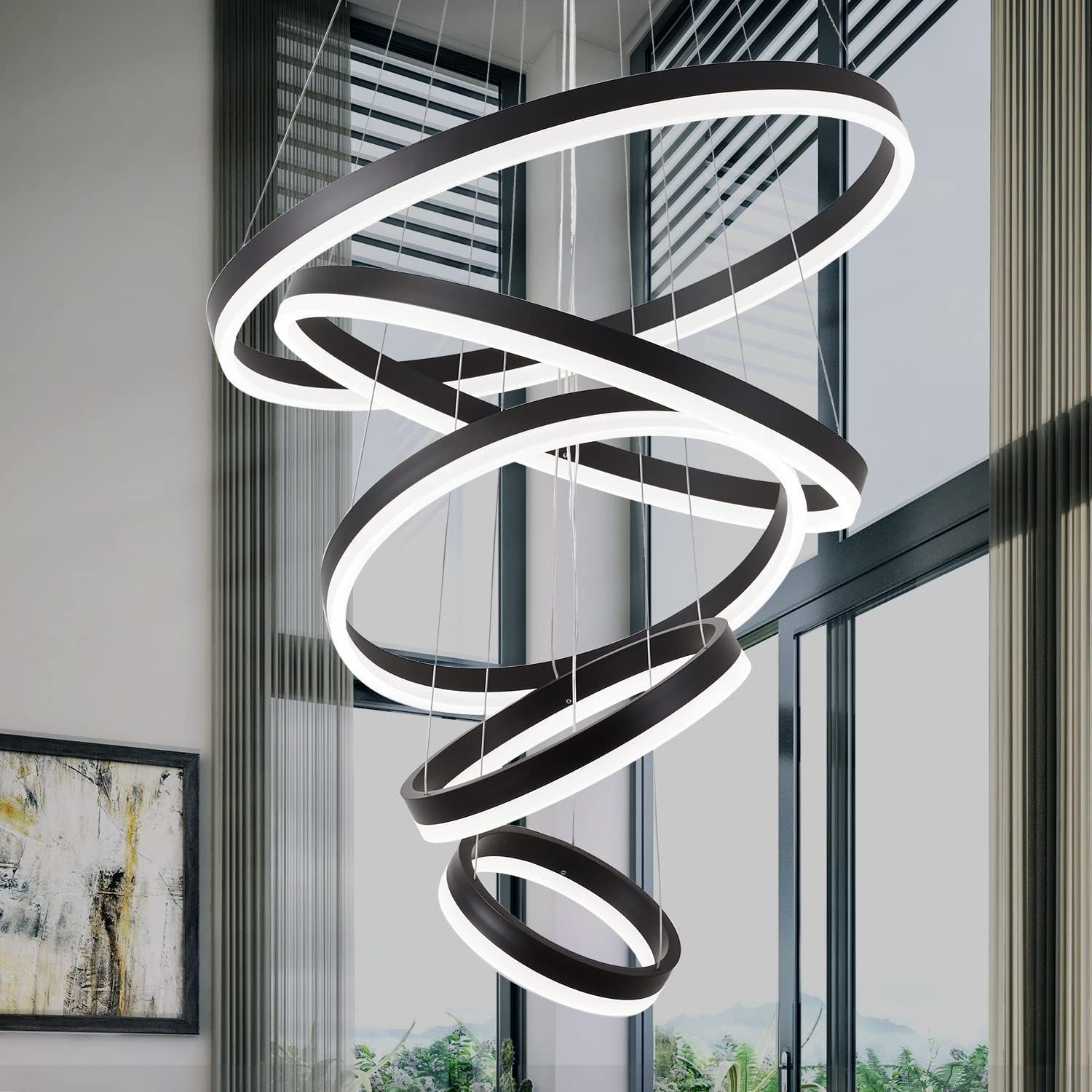 Modern black and white spiral chandelier hanging in a bright room
