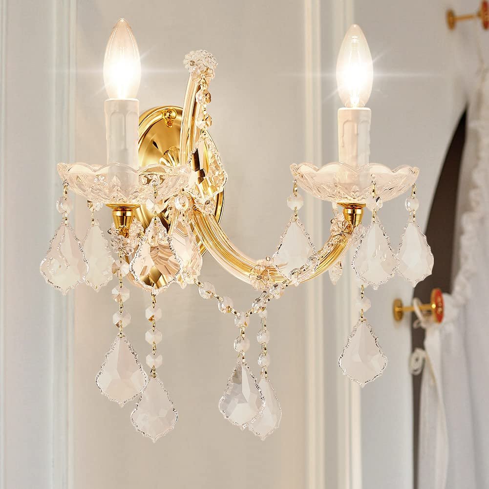 Gold wall sconce with two candle-shaped lights and crystal accents