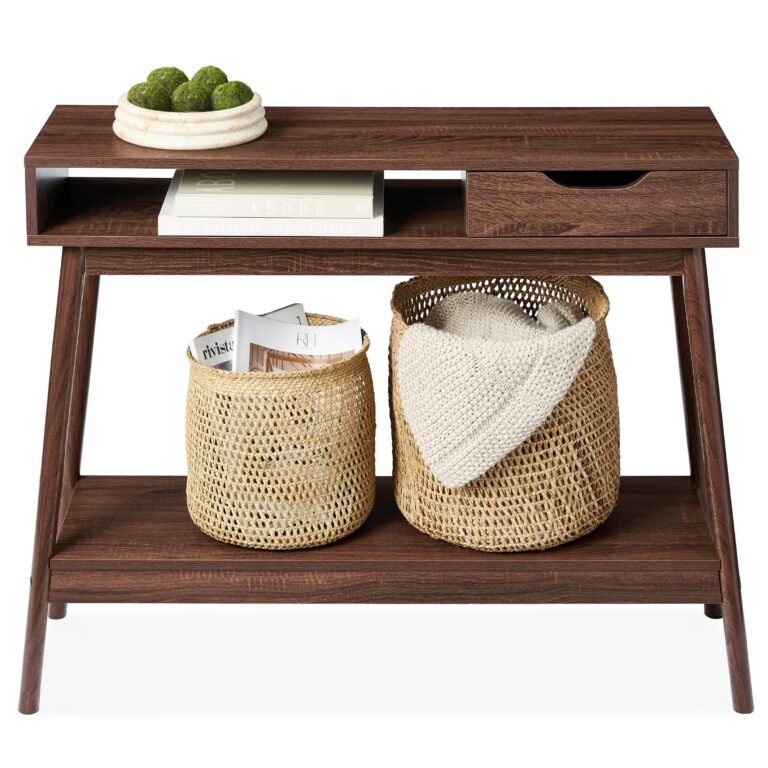 Wooden console table with baskets, books, and decorative moss balls