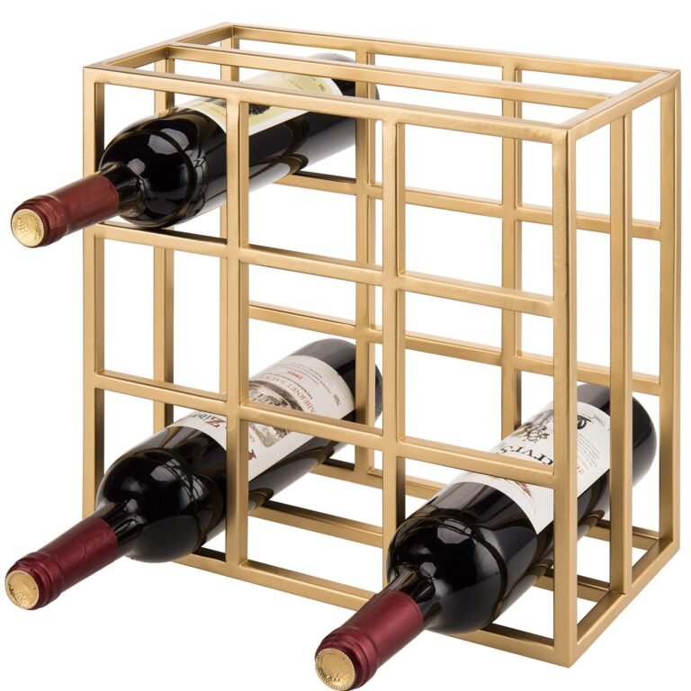 Gold wine rack holding three bottles of red wine
