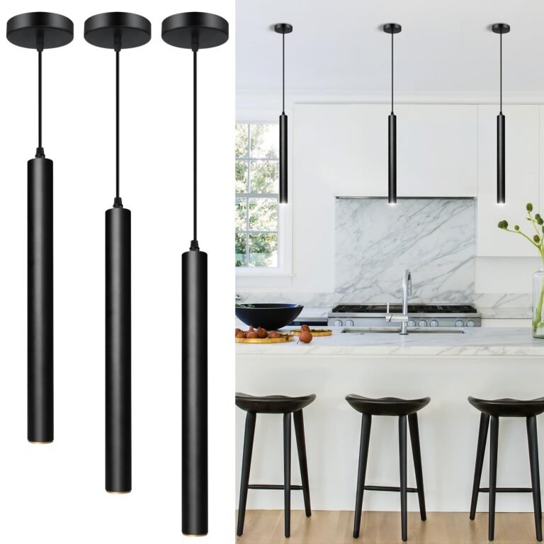 Black cylindrical pendant lights hanging above a kitchen island with stools